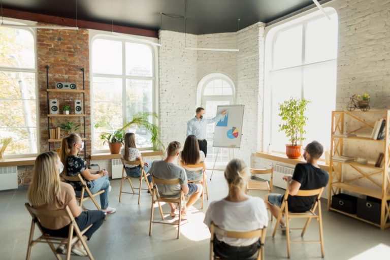 The meaning of a workshop in project management is an interactive meeting for team members.